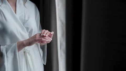 The bride holds a wedding ring in her hands Stock Footage 329094139