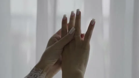 The bride holds a wedding ring in her hands Stock Footage 329248465