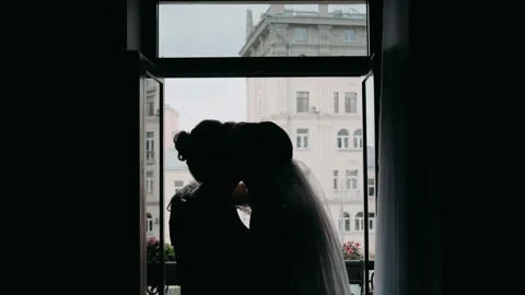 Bride hugging mother. Bride on wedding day holding her mother's hands. Mother of Видео 243420780