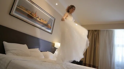 Bride Jumping on the Bed Stock Footage 123515343