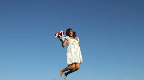 Bride jumping for joy Stock-Footage 61671684