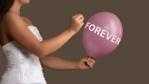 Bride lets a Balloon with Text burst with a needle Stock Photos