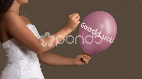 Bride lets a Balloon with Text burst with a needle Stock Photos