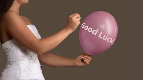 Bride lets a Balloon with Text burst with a needle Stock Photos