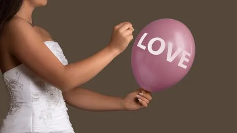 Bride lets a Balloon with Text burst with a needle Stock Photos