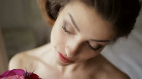 Bride looking at her bouquet close-up Stock Footage 63160781