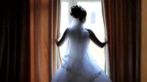 Bride looking out the window Stock Footage 43761164