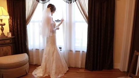 Bride looking out window Video stock 87537117