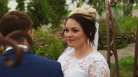 The bride looks at the groom Stock Footage 106354318