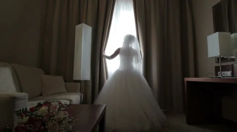 Bride Looks out of the Window Backlight Video stock 36581586