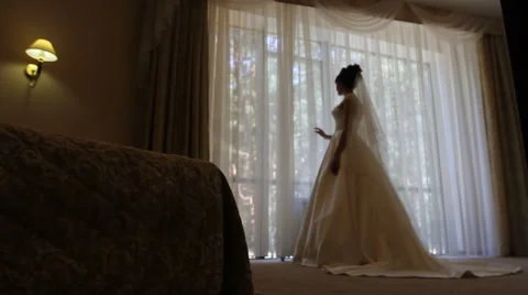Bride looks out of the window Stock Footage 61122736