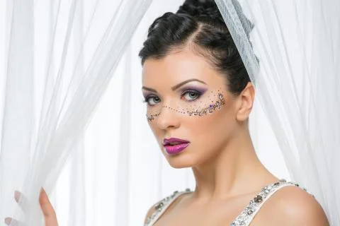 Bride with mask drawn on face Stock Photos