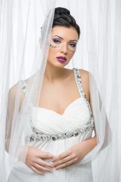Bride with mask drawn on face Stock Photos
