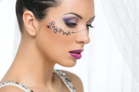 Bride with mask drawn on face Stock Photos