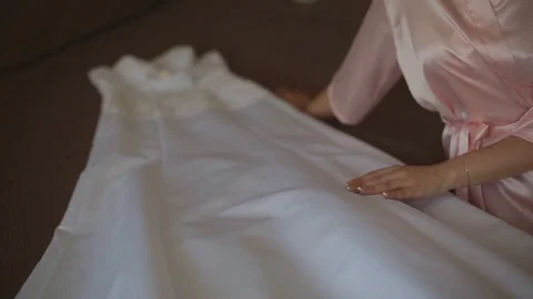 Bride in the morning in a transparent lace dress and underwear and stockings Stock Footage