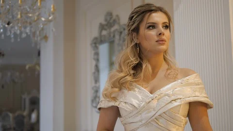 Bride with nice makeup poses looking away at photo session Stock Footage 121809504