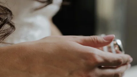 Bride Opening Bottle With Perfume. Video stock 107937809