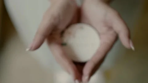 A bride opens her palms and shows a beautifully designed soap Видео 221511004