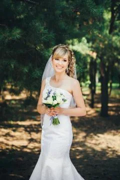 Bride outdoors in a forest Stock Photos