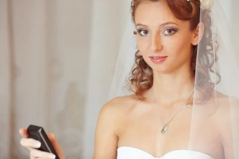 Bride with the phone Stock Photos