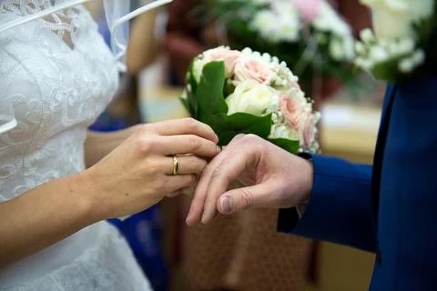Bride Placing Wedding Ring During Intimate Ceremony Moment Stock Photos