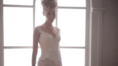 Bride posing against the bright window. Morning bride Video stock 104576647