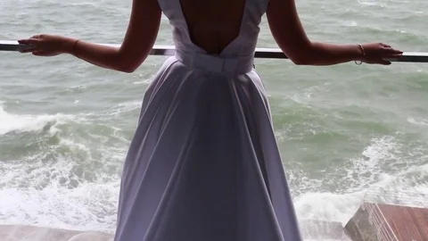Bride posing at balcony at sea resort hotel Video stock 71361973