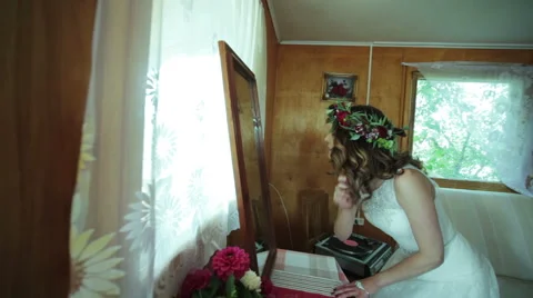 Bride preens before the mirror Stock Footage 60007800