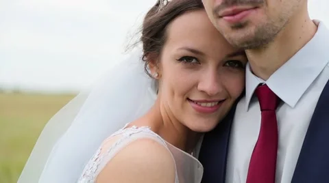 Bride pressed to groom close up Stock Footage 64916862