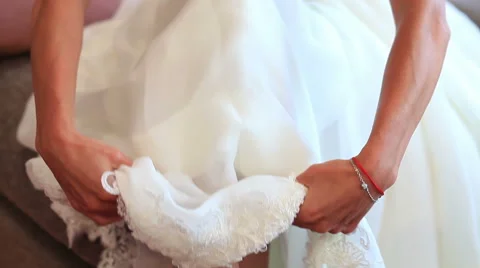 Bride pulling down her wedding dress Stock Footage 41873940