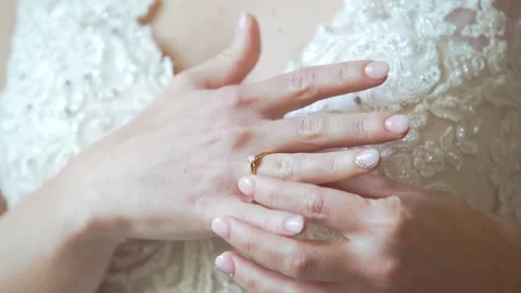 Bride puts on her wedding ring during a heartfelt ceremony Video stock 291690144