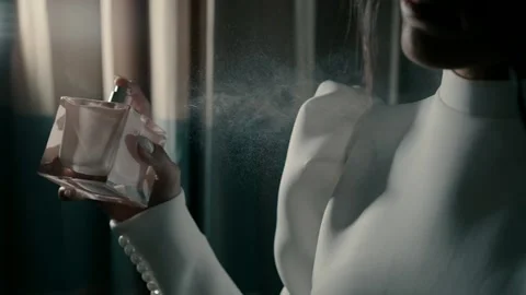 A bride puts perfume in the dressing room before the start of the wedding day. Stock Footage 221704708