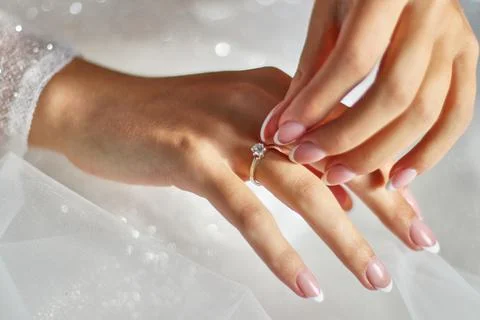The bride puts a ring on her finger. Preparation for the wedding. Wedding celebr Stock Photos