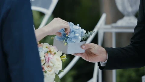 The bride puts the wedding ring on finger of the groom. marriage hands with 스톡 동영상 102381839