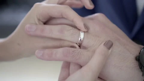 Bride Puts The Wedding Ring On Groom's Finger. Marriage, Hands With Rings slow 스톡 동영상 153338802