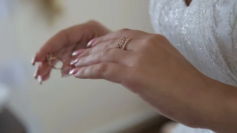 The bride puts a wedding ring on her finger 스톡 동영상 123836128