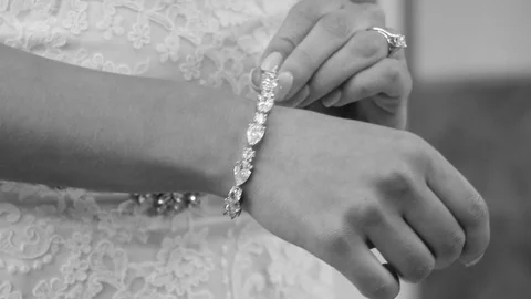 Bride Putting on Diamond Bracelet Stock Footage 87307382
