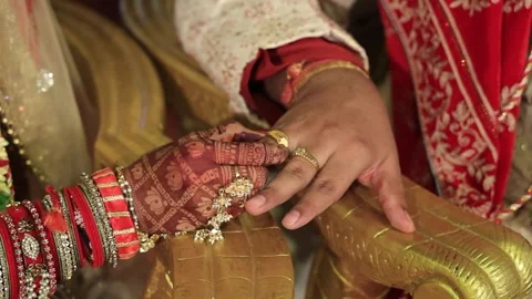 Bride putting a ring on groom's finger, Indian Wedding Rituals 스톡 동영상 247020563