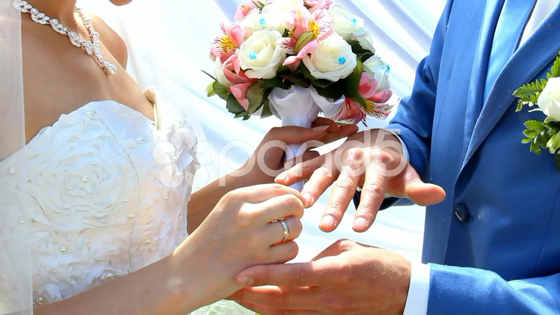 Bridegroom And Bride Kissing And Showing Wedding Rings On Their