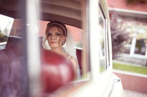 Bride in a retro car Stock Photos
