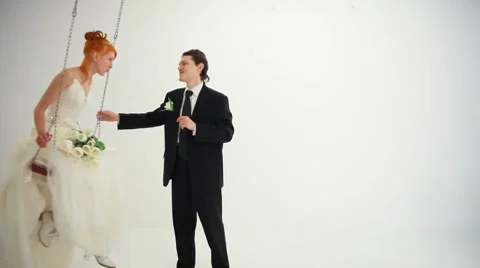 Bride rides on a swing Stock Footage 8561098