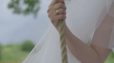 Bride riding on a swing Stock Footage 56575423