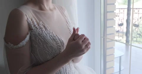 The bride rubs her hands close-up, worries before the wedding. Wedding jitters Stock Footage 221433238