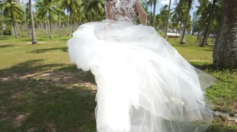 Bride is running on the island. Stock Footage 60780844