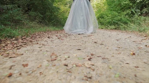 Bride is running in the woods Stock Footage 116264759