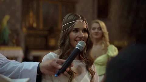 Bride saying vows at a Catholic wedding Stock Footage 310723619