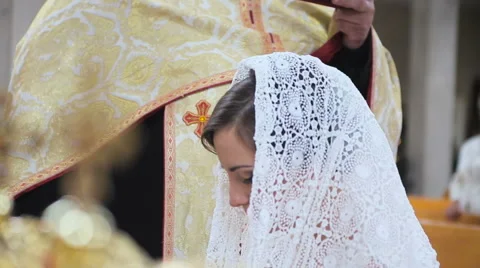 Bride in a scarf in the church Stock Footage 63626097