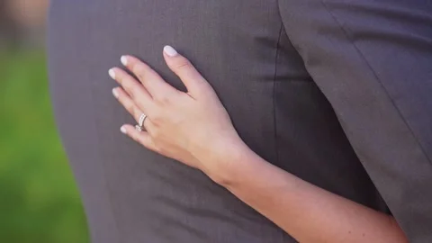 Bride scratches grooms back. Close up Stock Footage 136263953