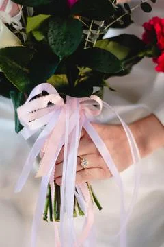 Bride shows off wedding ring and flowers Stock Photos