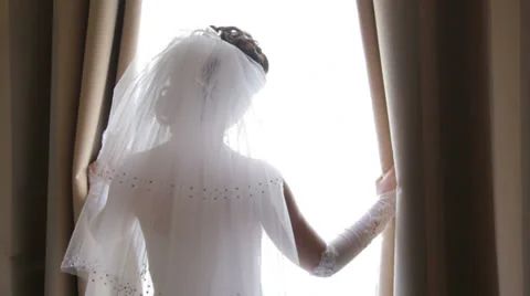 Bride Silhouette Looks out the Window Video stock 36582000